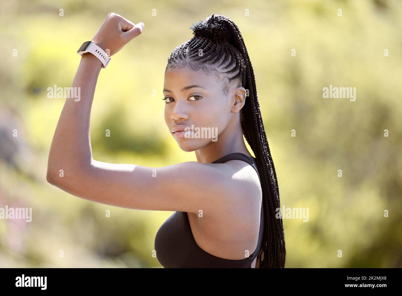 Fitness, flexing and black woman with muscle in nature ready for arms training, biceps and outdoor workout in summer. Portrait, lifestyle and strong Stock Photo
