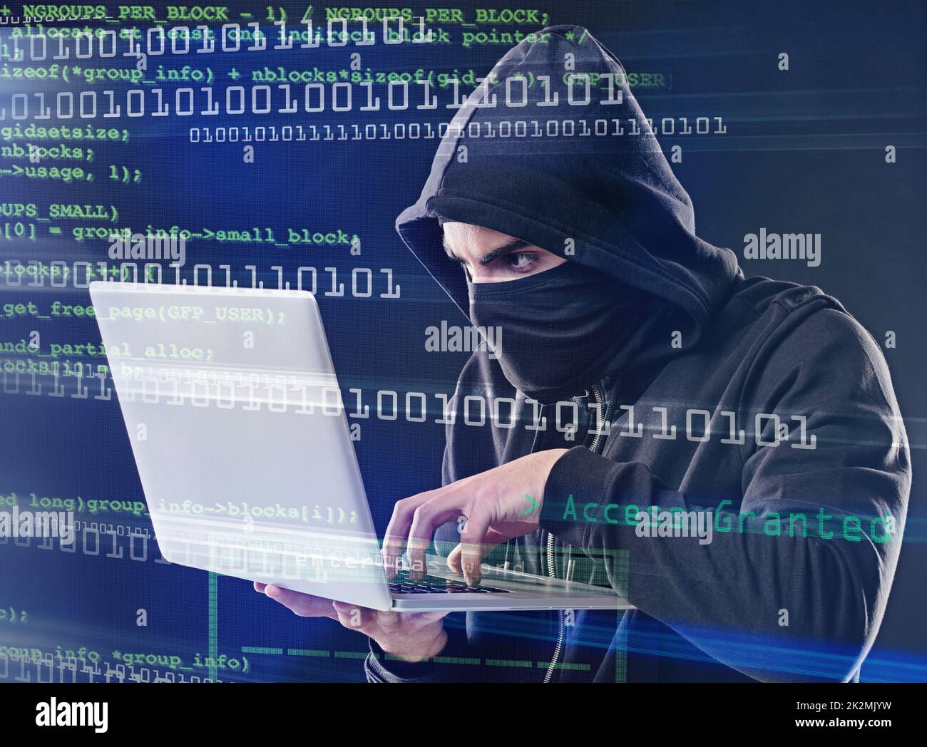 Hes about to crack the code. Shot of a computer hacker using a laptop