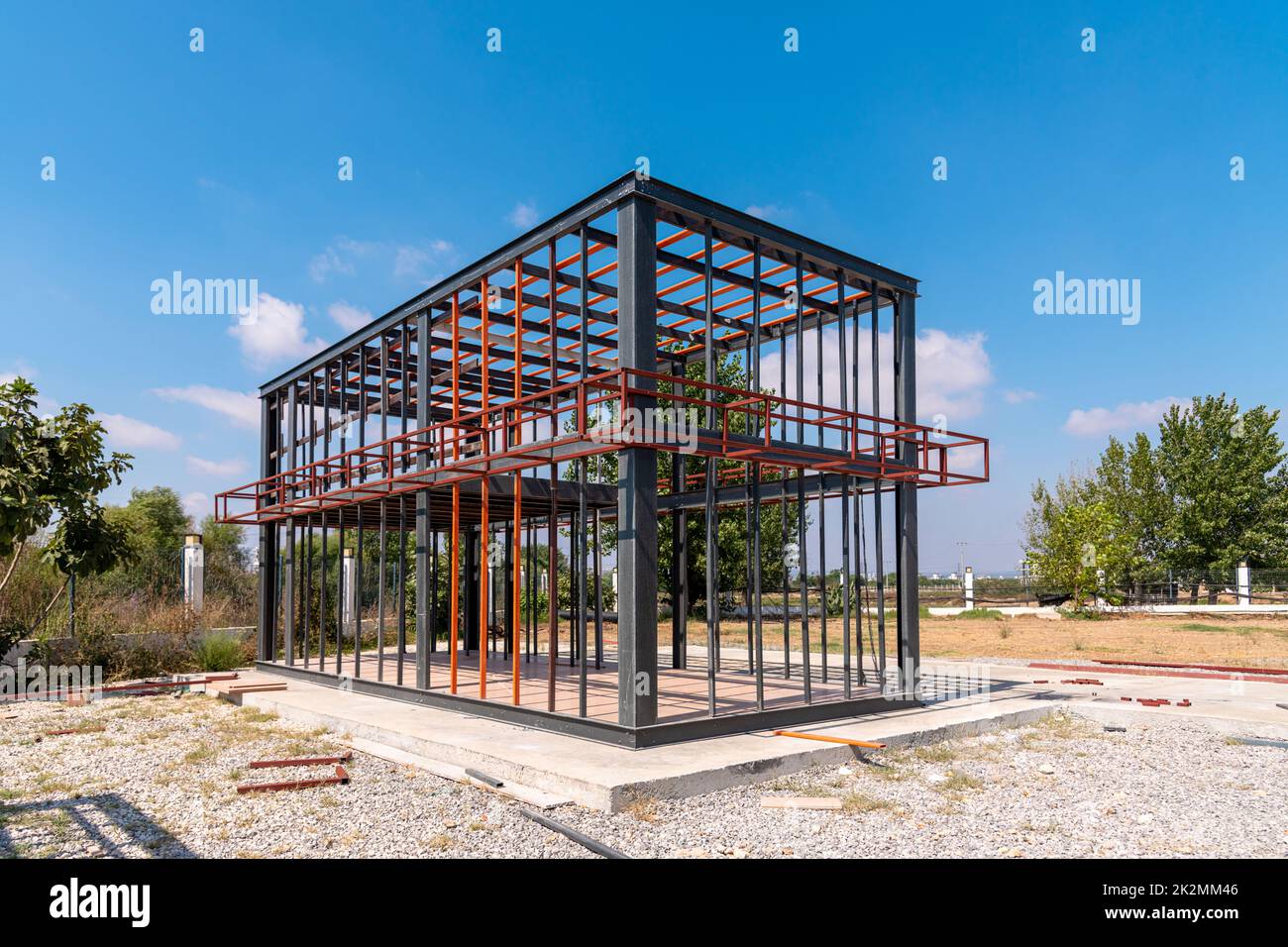 Metal frame of newly built building. Construction of a new tiny house Stock Photo