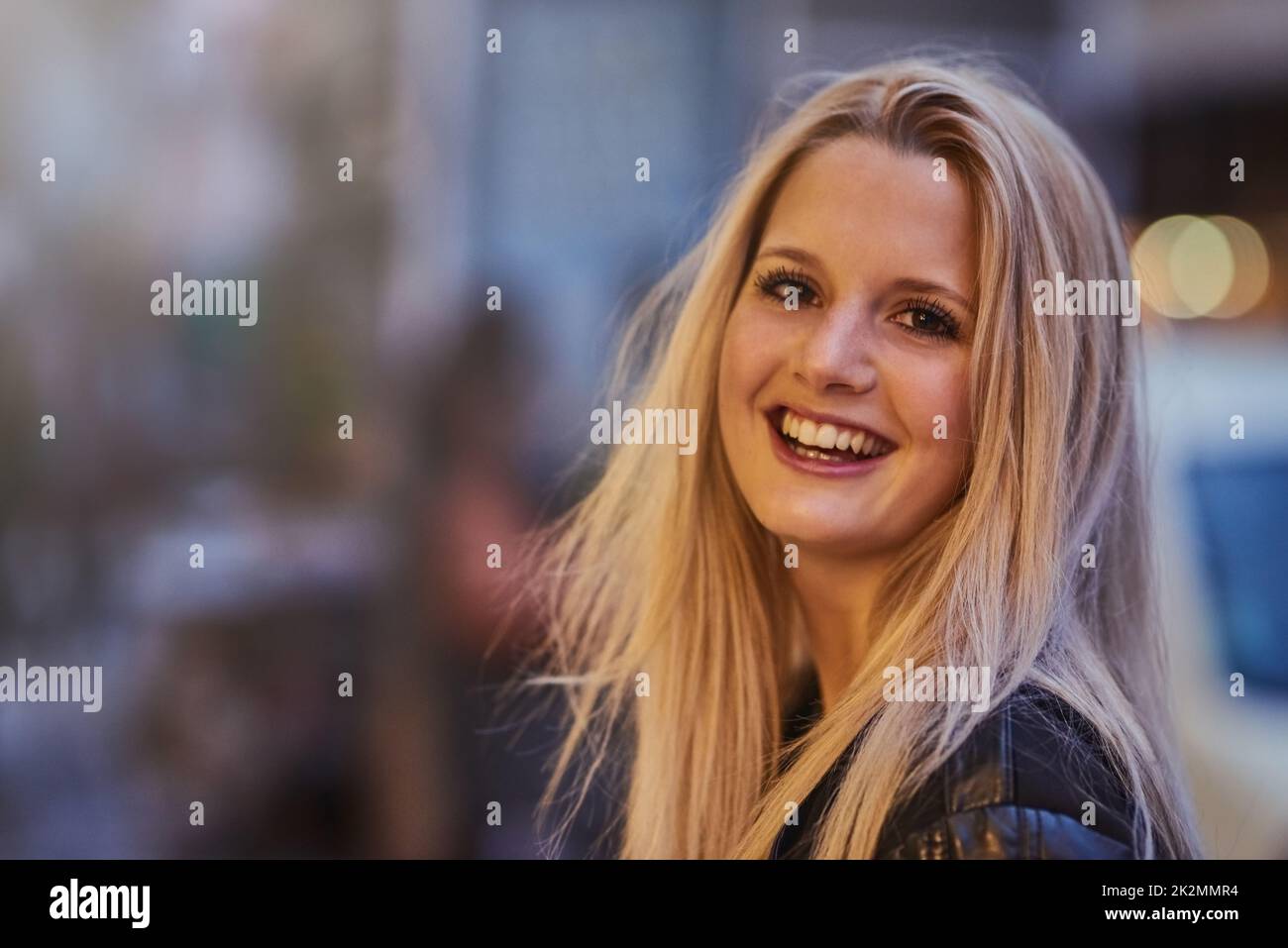 Im a city girl all the way. Shot of a confident young woman out and about in the city at night. Stock Photo