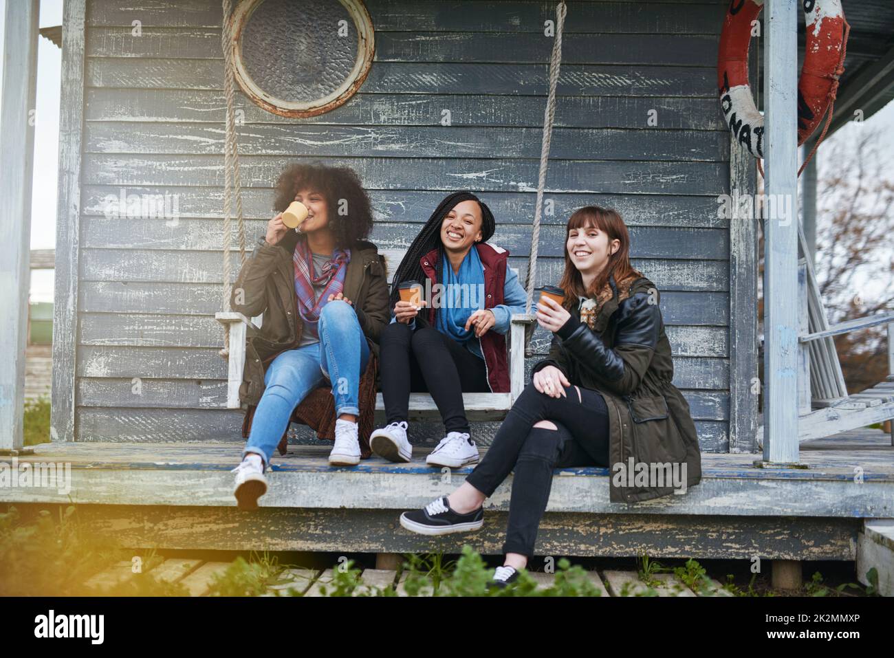 Women sitting on a porch hi-res stock photography and images - Alamy