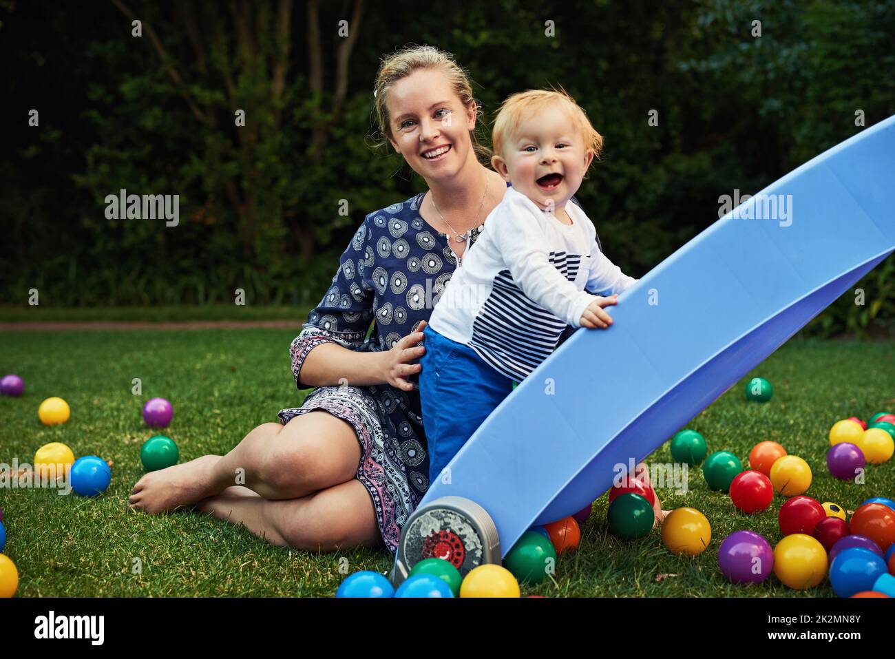 Having fun with Mommy. Shot of an adorable little boy and his mother playing in the backyard. Stock Photo