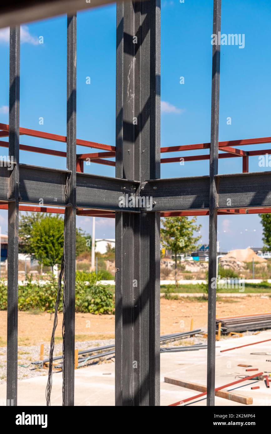 Structural steel beam connections, metal column supporting the roof construction. Structural steel concept Stock Photo
