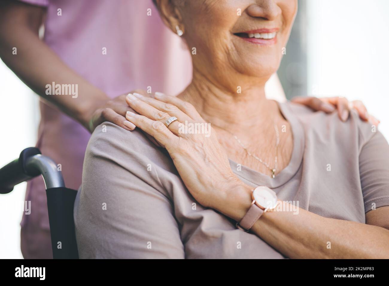 A bond of ages. Cropped shot of a nurse caring for an older woman in a wheelchair. Stock Photo