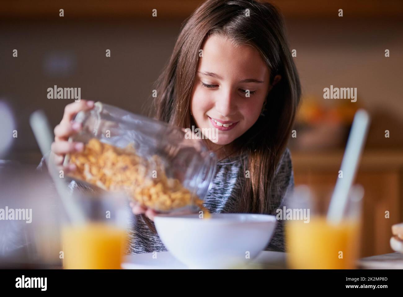 She loves cereal for breakfast, lunch and dinner. Cropped shot of a