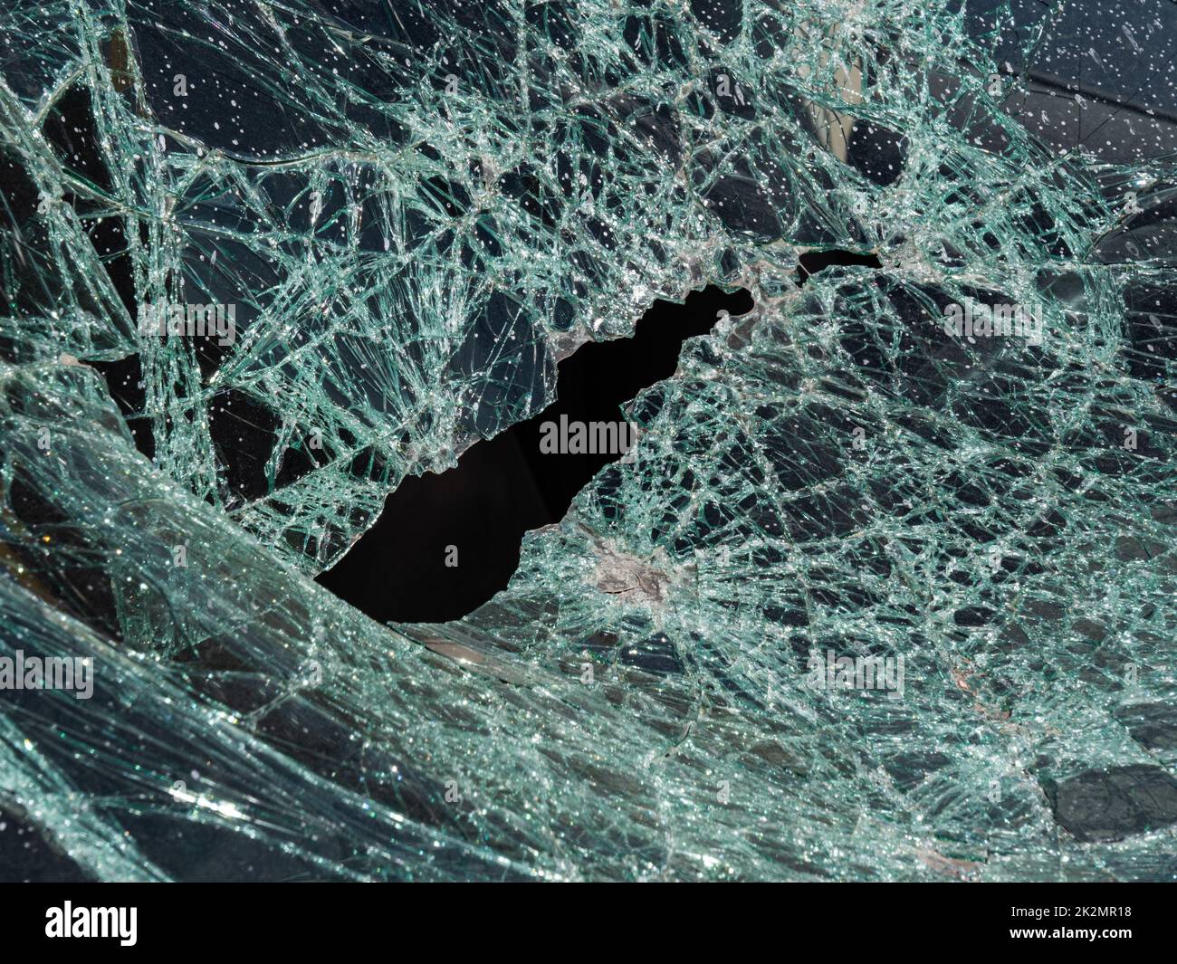 Close-up broken car windshield. Broken and damaged car. Stock Photo