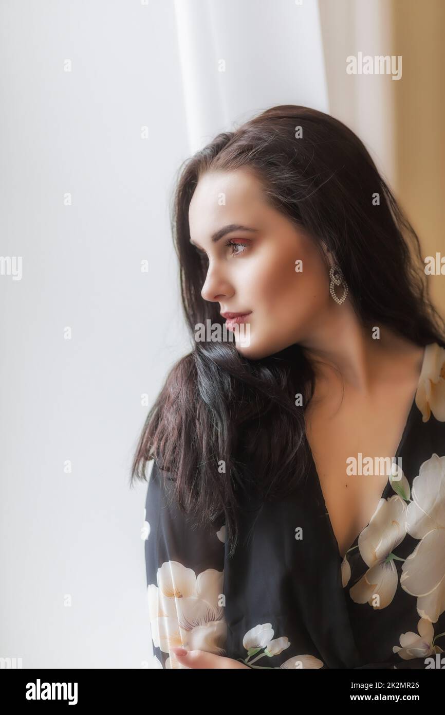 Side view portrait of atractive dark haired girl. Stock Photo