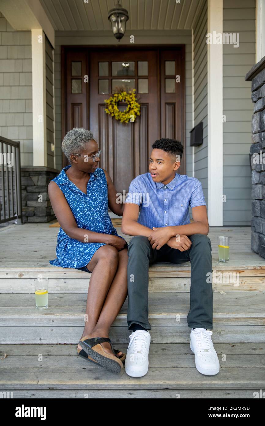 Family on front porch candid hires stock photography and images Alamy