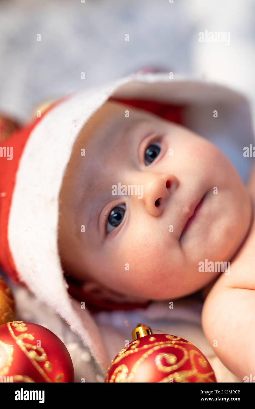 Newborn baby wearing a Santa Hat Stock Photo