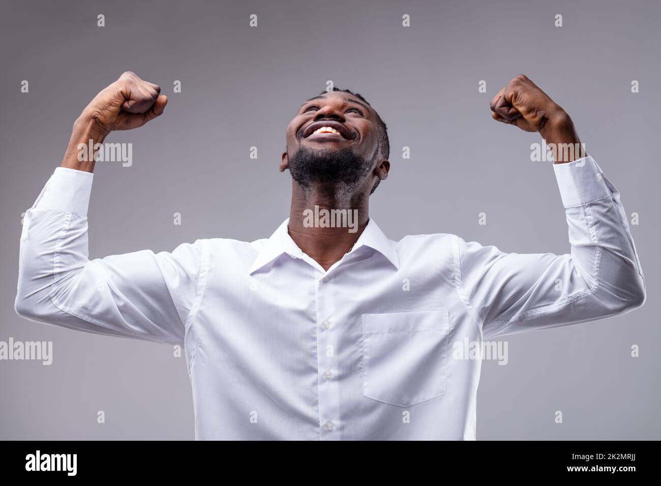 afroamerican man with his arms raised Stock Photo