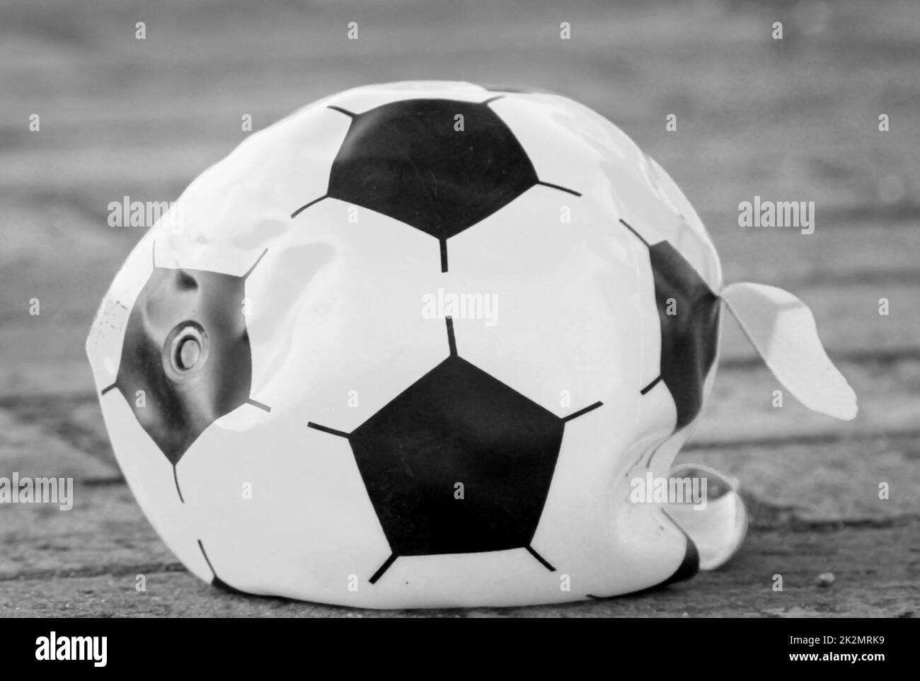 The air is out of a soccer. Stock Photo