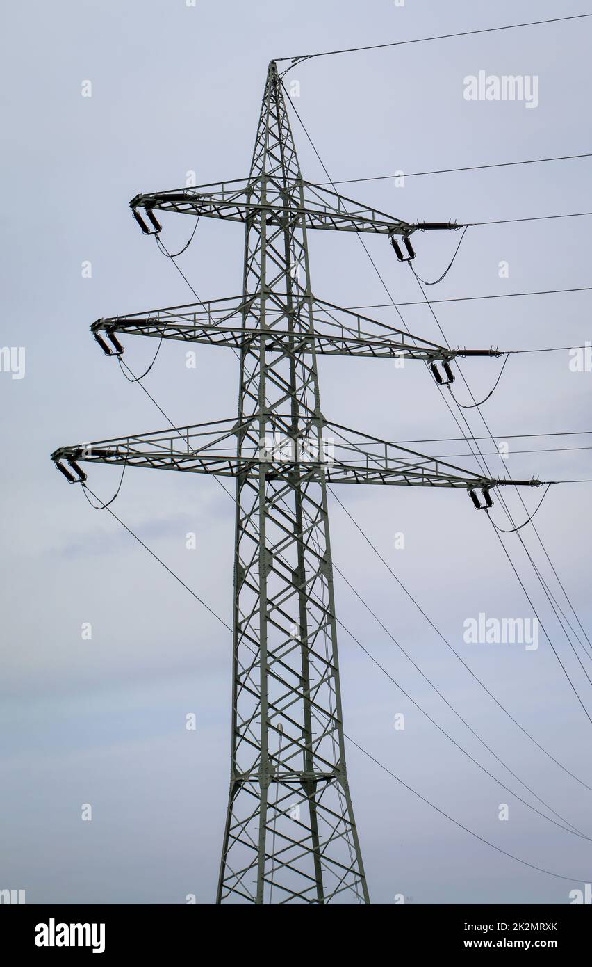 The steel pole from a power pole. Power lines are held by a metal pole. Stock Photo