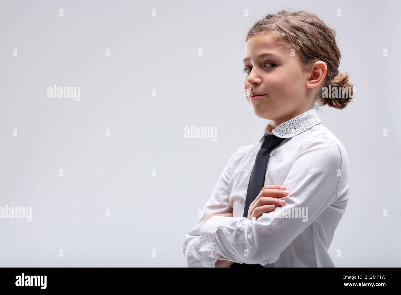 Young girl looking speculatively at the camera Stock Photo