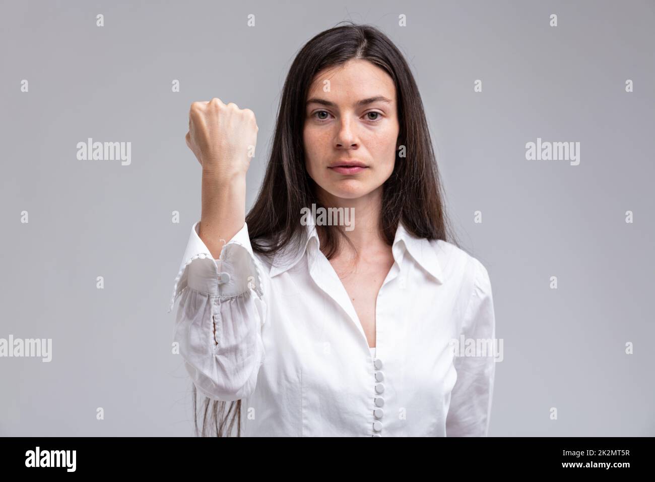 focus on the FIST of a stern woman Stock Photo