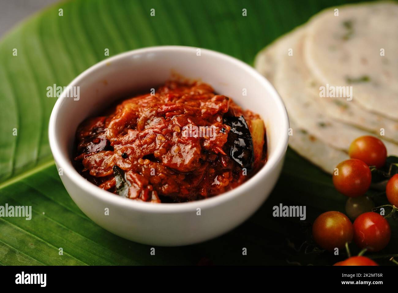 Homemade Tomato pickle Thokku or Chutney served with rice dosa South