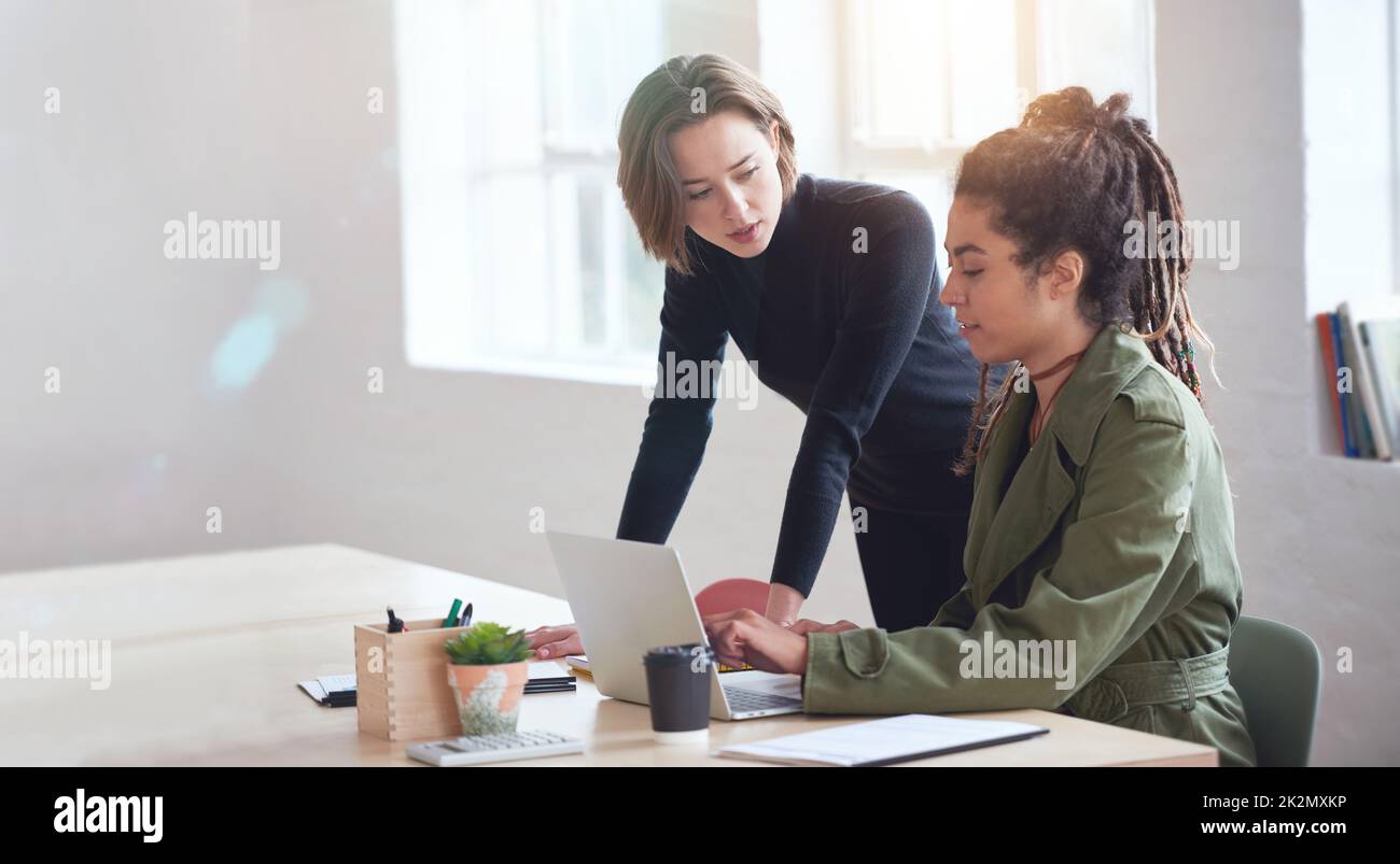 Two business women students using laptop computer team leader woman ...