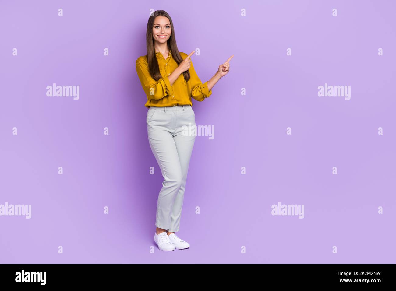 Full length photo of ceo brown hair lady index promo wear blouse trousers shoes isolated on purple color background Stock Photo