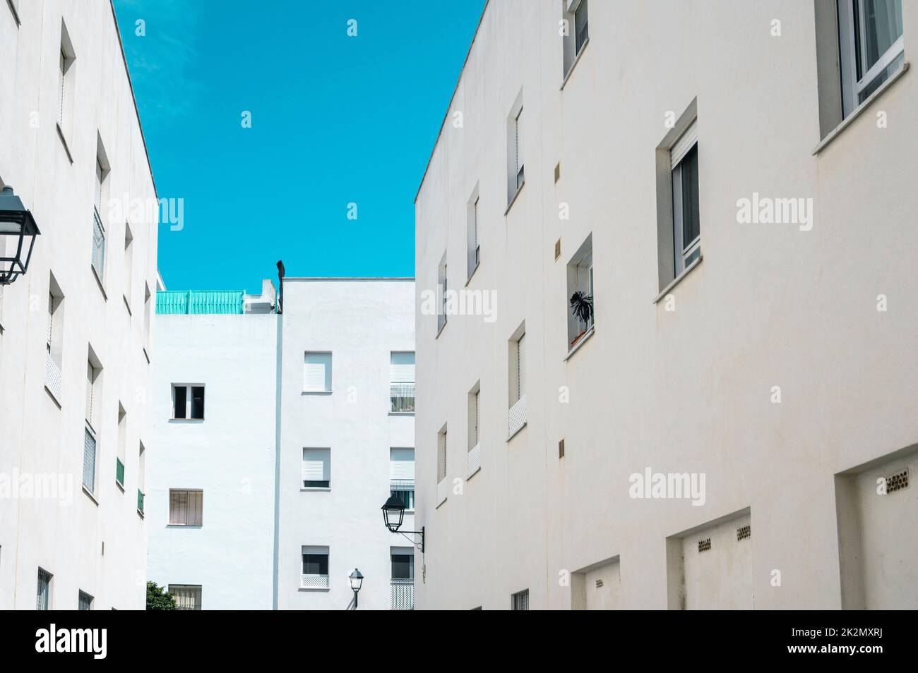 A white painted block of flats or apartments in Cadiz Spain showing the