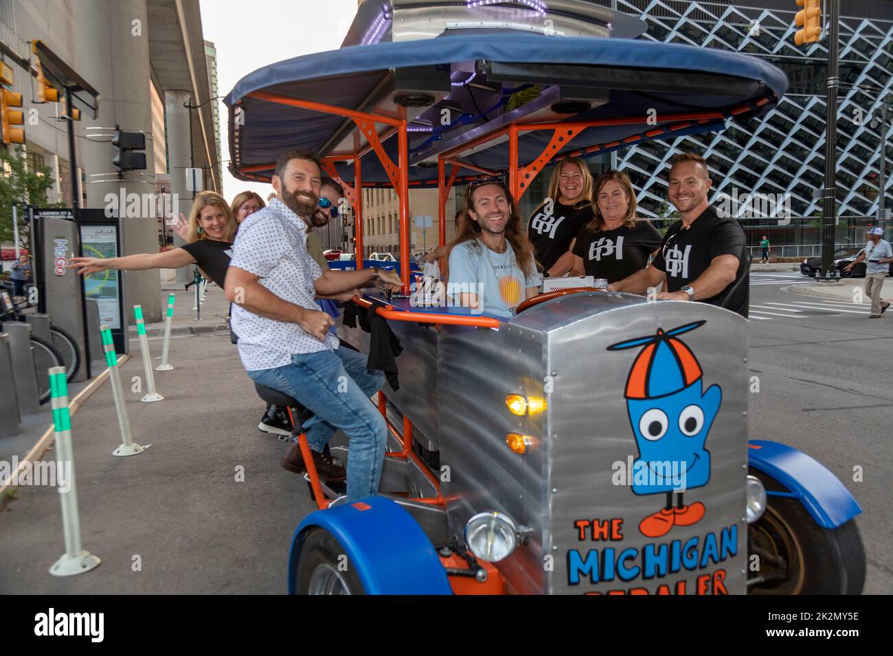 Detroit, Michigan - The Michigan Pedaler pedal bar hosts a rolling party on downtown streets. Stock Photo