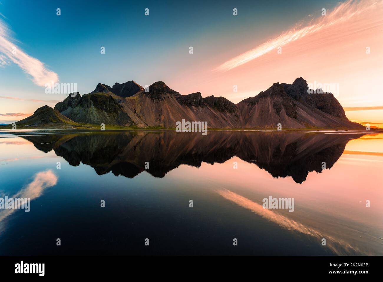 Beautiful Sunrise Over Vestrahorn Mountain Range And Water Reflection 