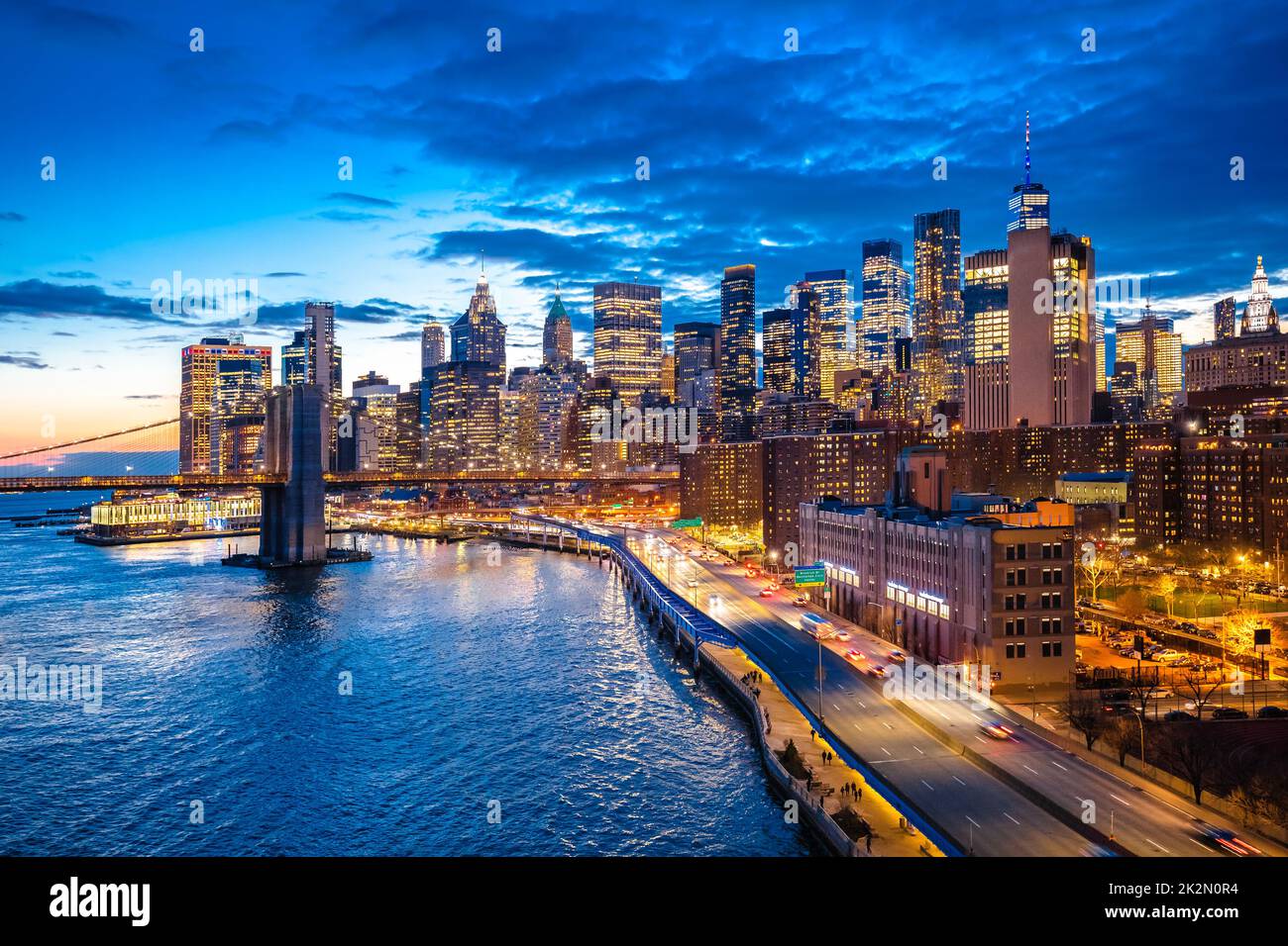 Epic skyline of New York City downtown and Brooklyn bridge evening view Stock Photo