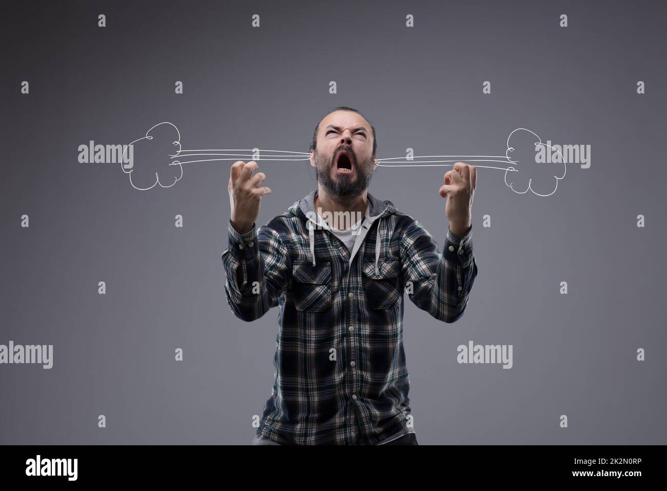 Very angry man letting off steam Stock Photo