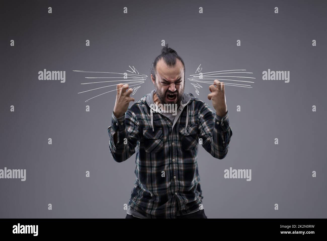 Angry man screaming and throwing a temper tantrum Stock Photo