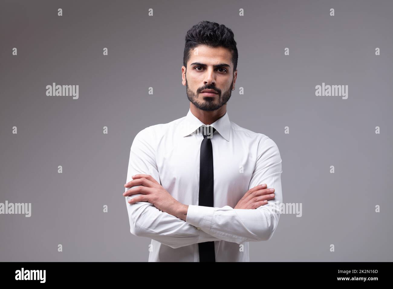 Young bossy man with white shirt and necktie Stock Photo