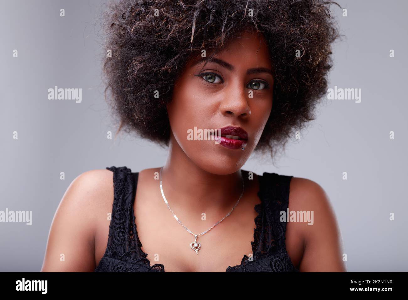 Young black woman with beautiful grey eyes looking at camera Stock Photo