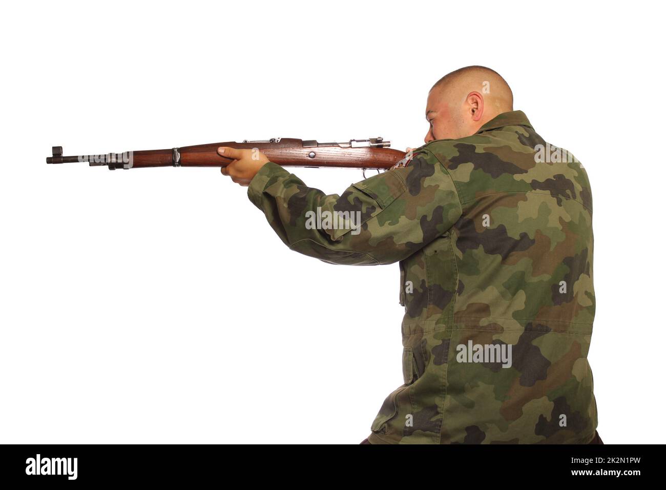 Man Wearing Camouflage Holding a Gun Isolated on White Background Stock Photo