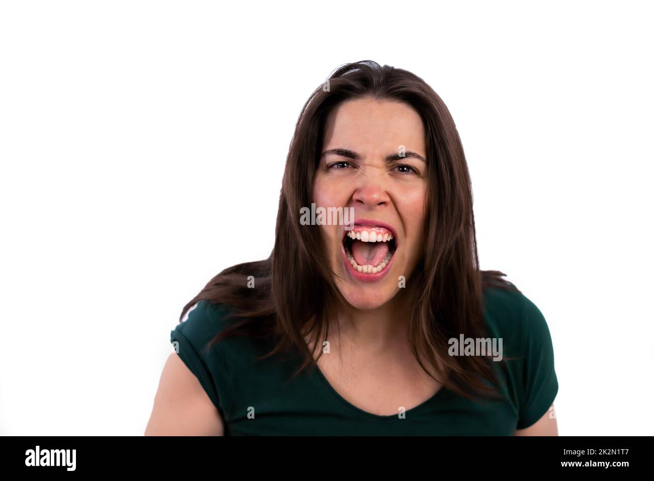 close-up of young girl screaming on white background Stock Photo