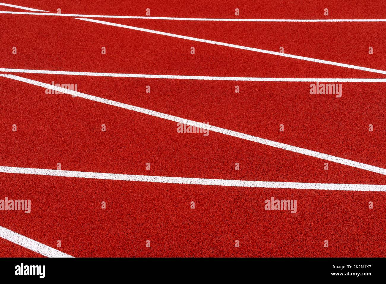 Red running track white lines Stock Photo