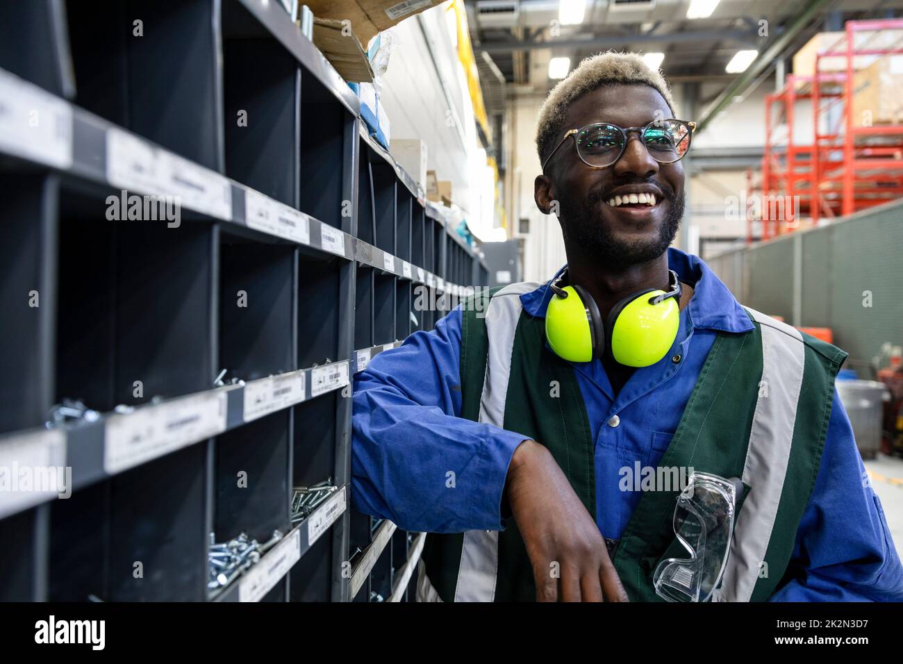Portrait happy male transit worker in maintenance facility Stock Photo
