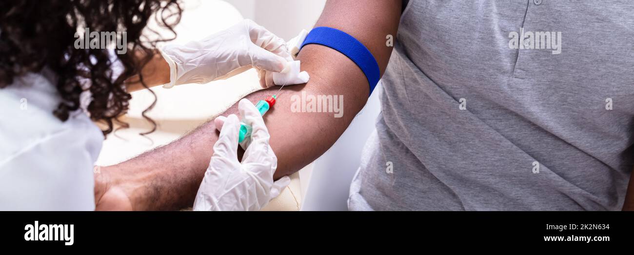 Doctor Taking Blood Sample Stock Photo Alamy