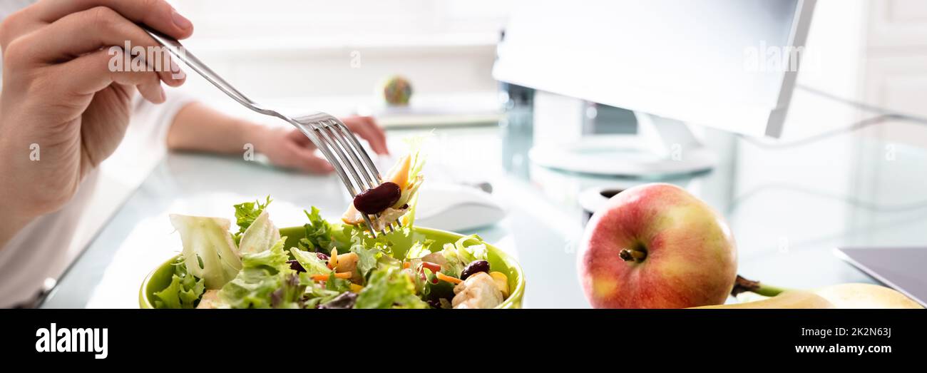 Healthy Salad On Office Desk Stock Photo