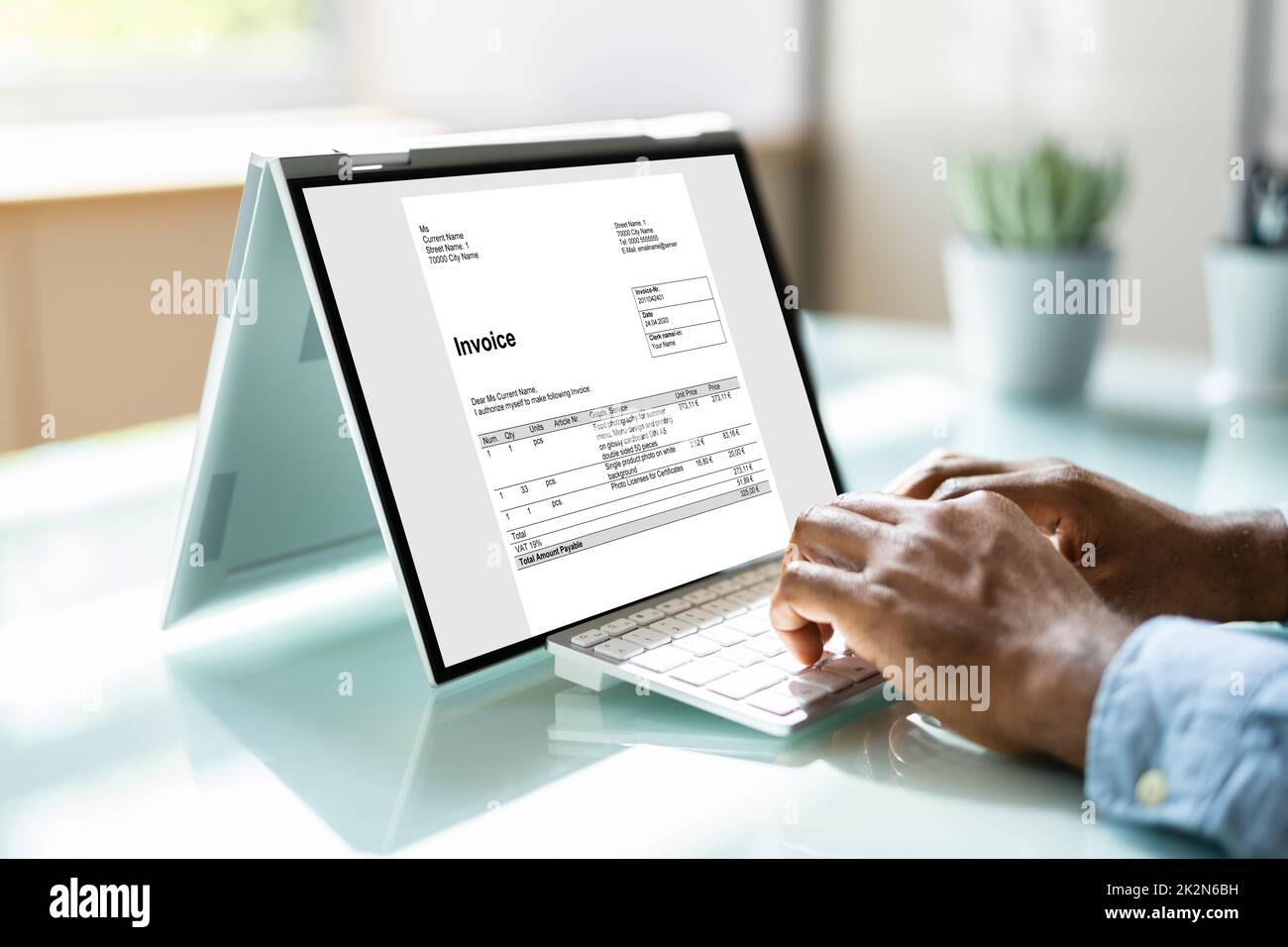 Young Businessman Using Laptop Stock Photo