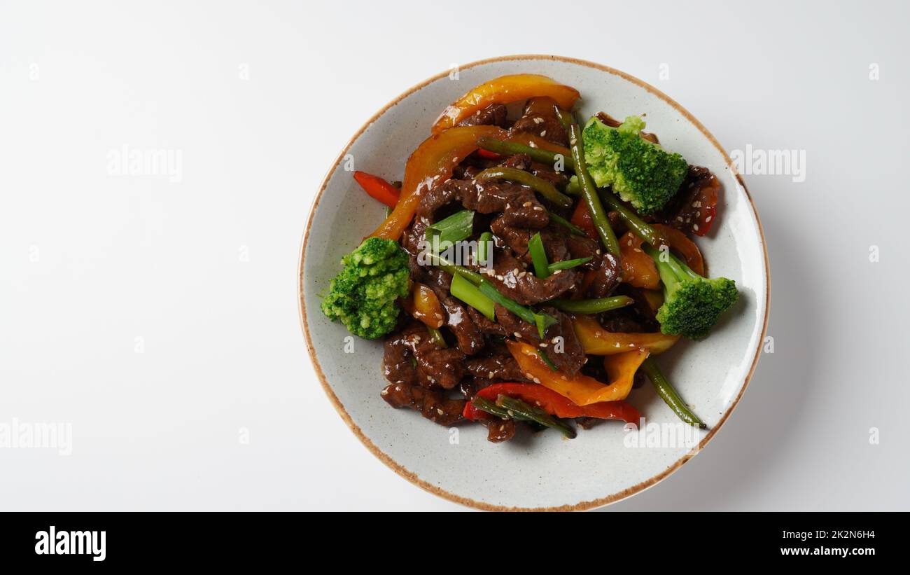 Mongolian barbecue with meat and vegetables in Thai restaurant Stock Photo