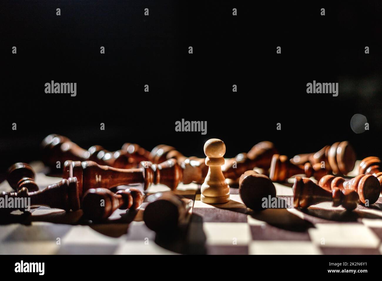 White Chess King Among Lying Down Black Pawns On Chessboard High-Res Stock  Photo - Getty Images