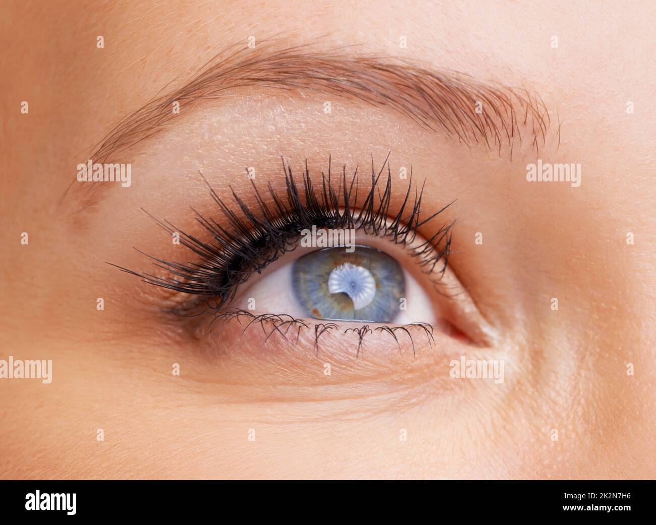Beautifully flecked eye. Closeup of a young womans eye. Stock Photo