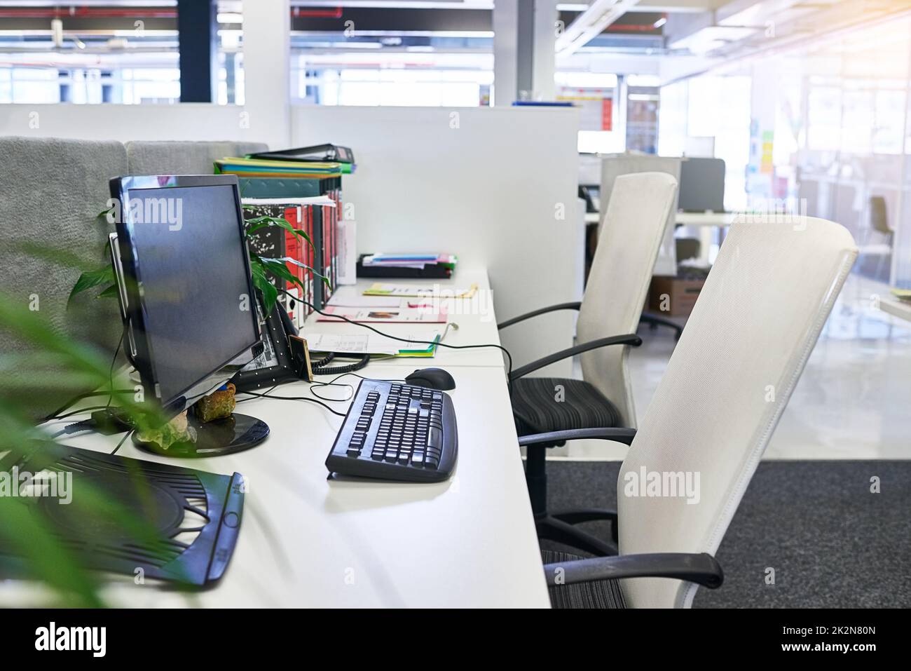 An organised desk is key to success. Shot of an empty office. Stock Photo