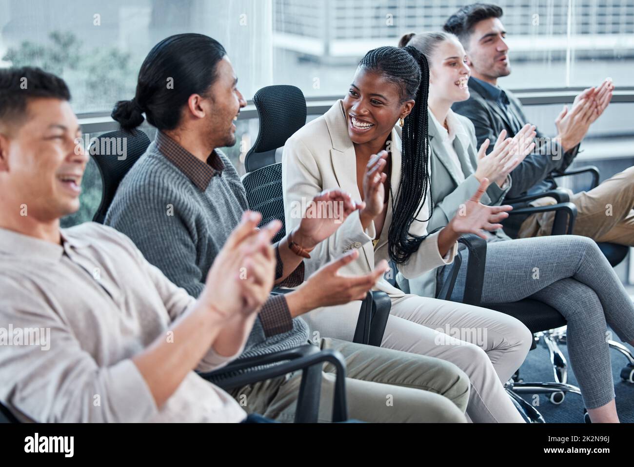 Clap for others while you wait for your turn. Shot of a group of businesspeople having a meeting in a boardroom at work. Stock Photo