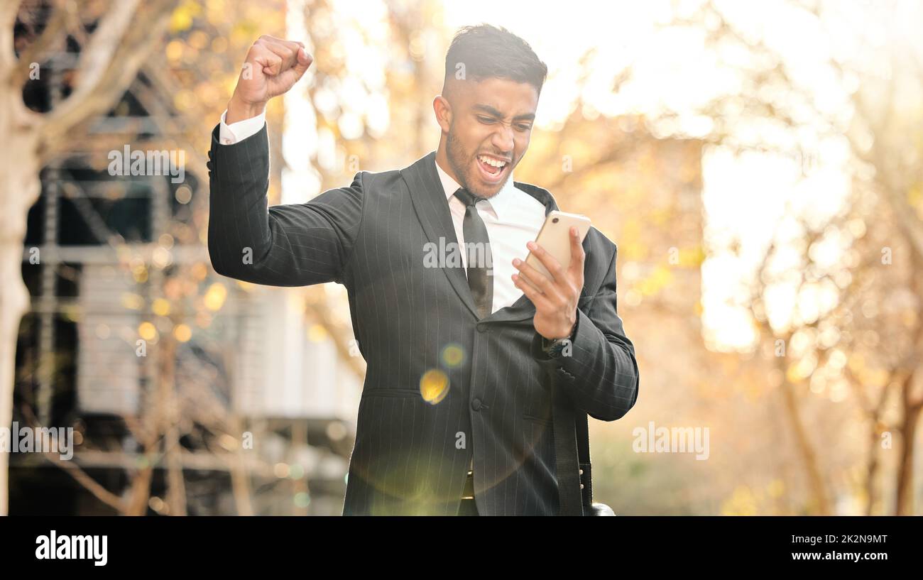 This is the best news. Shot of a young businessman cheering in excitement. Stock Photo