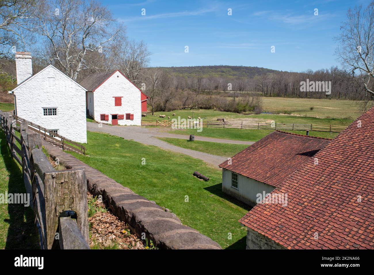 Colonial American rural village landscape with white stone buildings Stock Photo