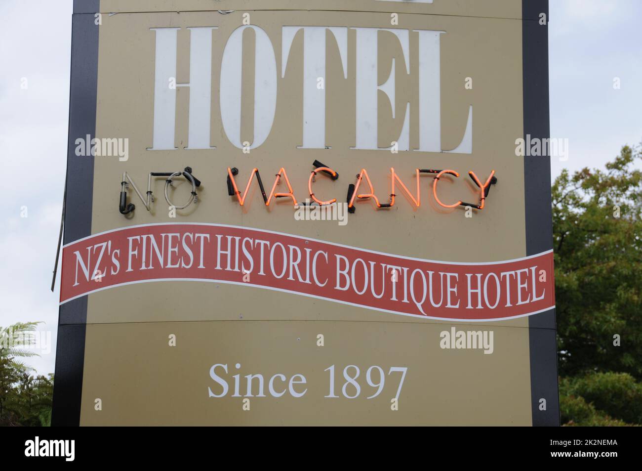 A hotel sign  at the 1897 Victorian built Princes Gate Hotel was New Zealand's first private hotel in Rotorua, a town on the shore of lake Rotorua on Stock Photo