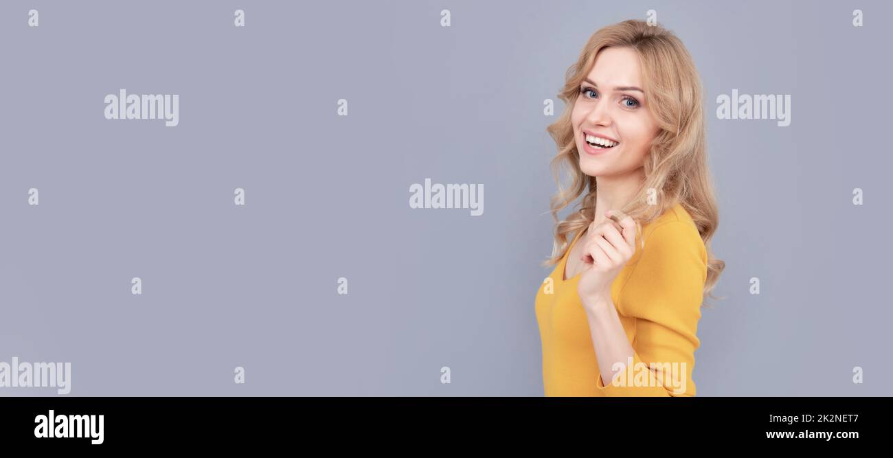 Woman isolated face portrait, banner with mock up copy space. copy space. happy lady with curly hair. fashion and beauty. female fashion model. Stock Photo