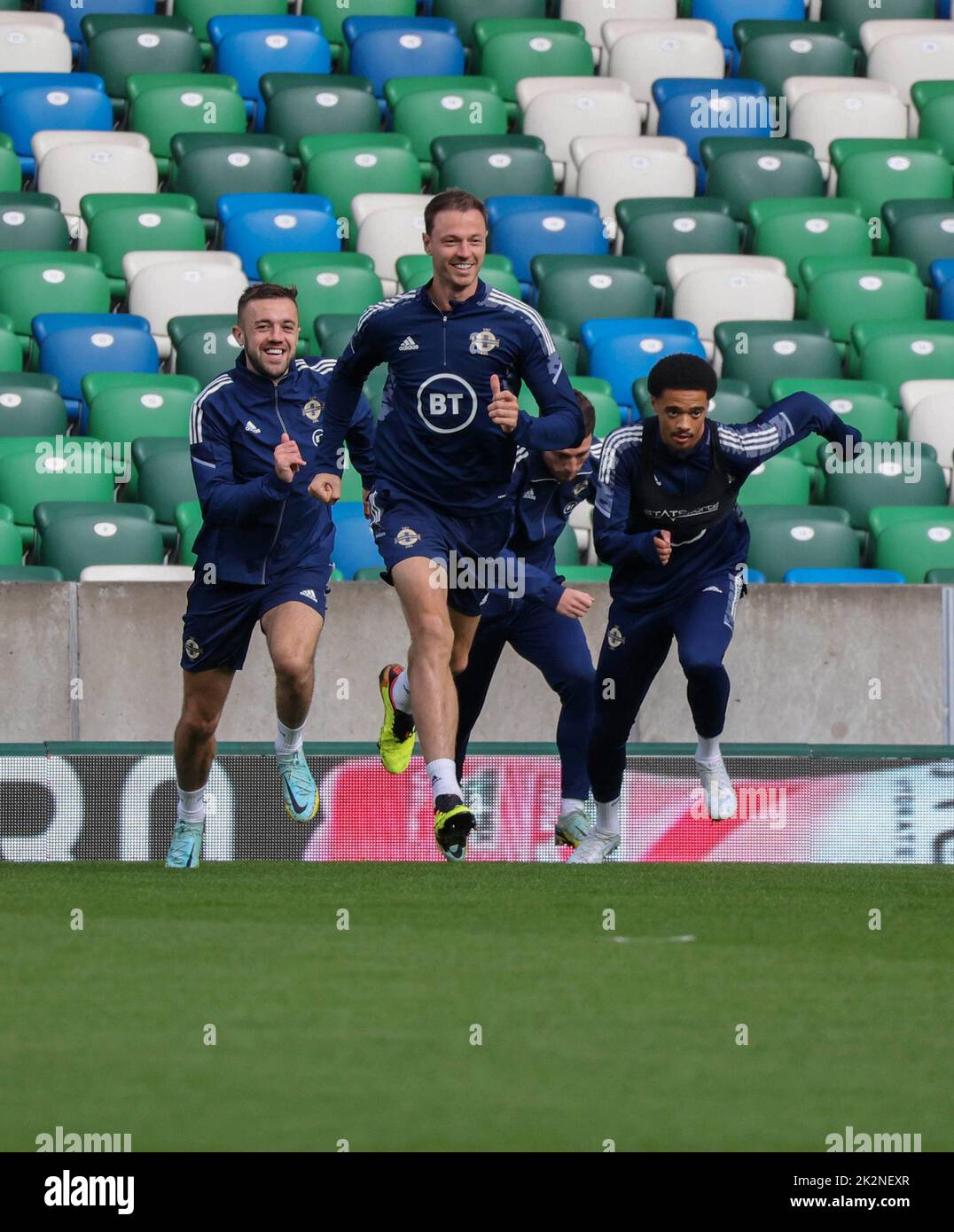 National Football Stadium at Windsor Park, Belfast, Northern Ireland, UK. 23 Sep 2022. The Northern Ireland squad train ahead of tomorrow evening's game against Kosovo. Jonny Evans leads the way with Conor McMenamin (left) and Jamal Lewis 9right). Credit: David Hunter/Alamy Live News. Stock Photo