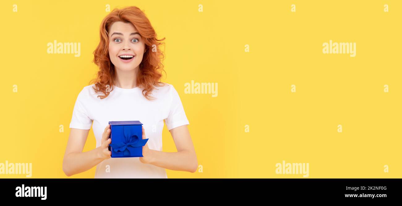 Spread a little happiness. Surprised girl hold gift box yellow