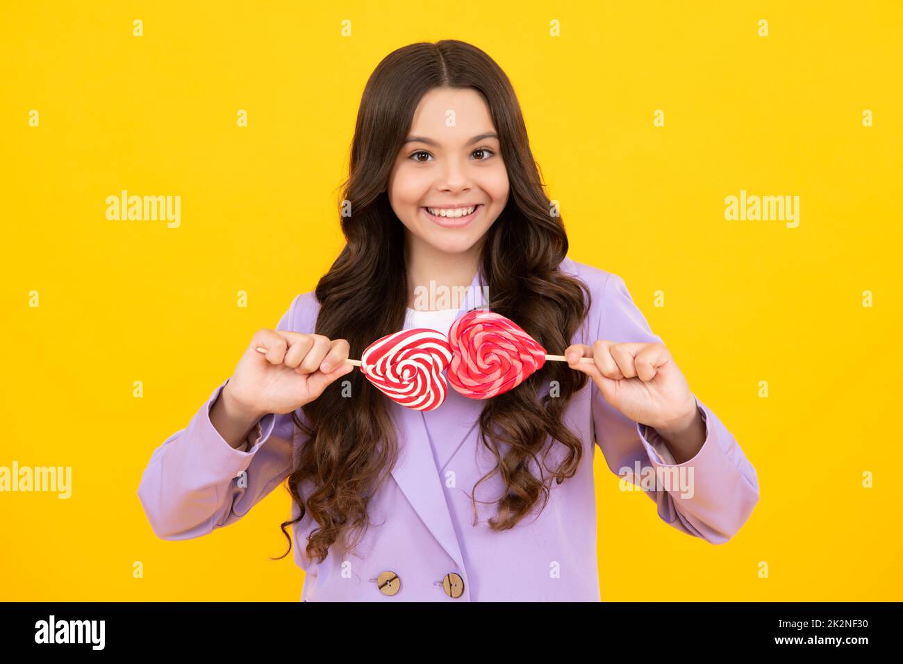 Child with lollipops candy. Stop eating sweets, sugar addiction. Teen dental care, sweet tooth. Stock Photo