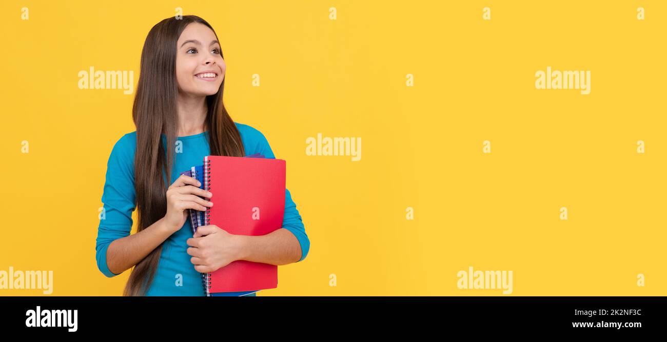 happy teen girl wuth school notebook for making notes, homework. Banner of school girl student. Schoolgirl pupil portrait with copy space. Stock Photo