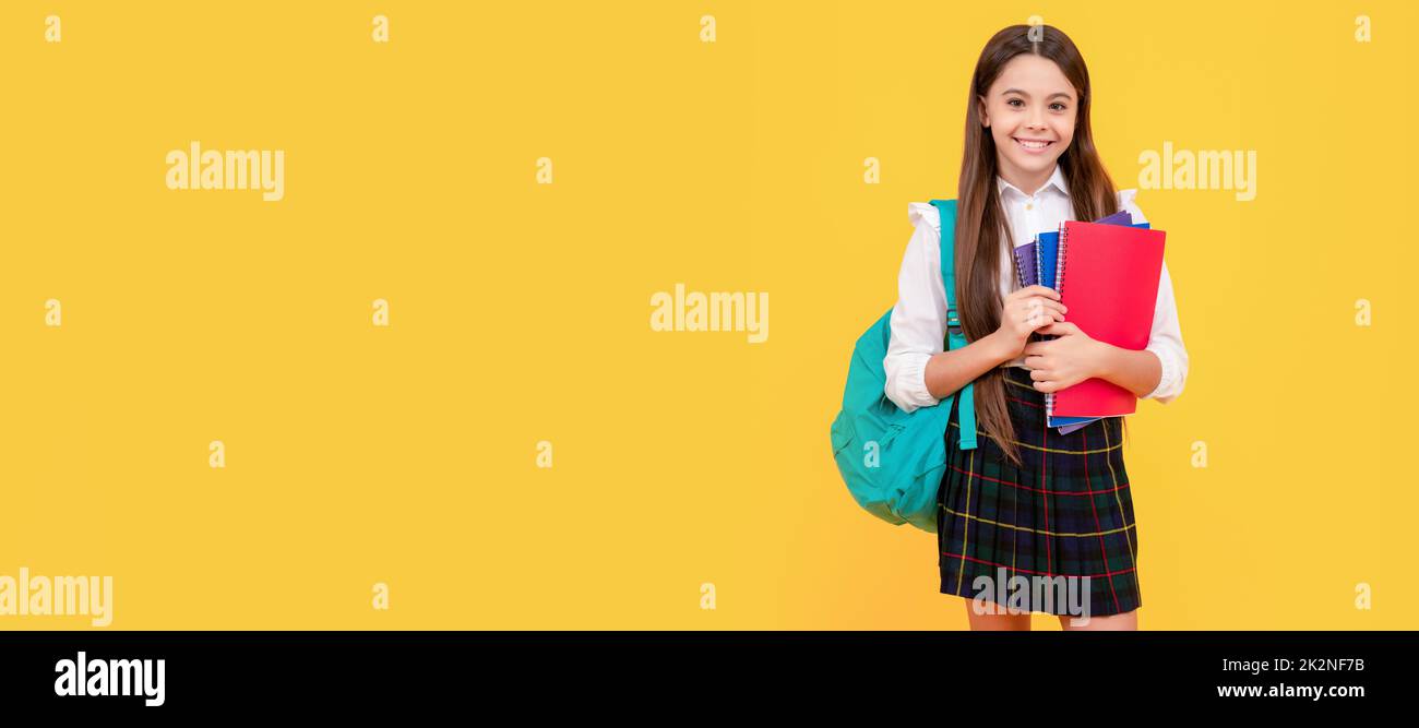 schoolgirl with notepad and backpack. back to school. teen girl ready to study. Horizontal isolated poster of school girl student. Banner header Stock Photo